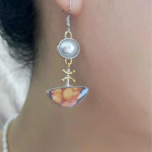 Retro-Chic Orange Earrings with a Divine Touch